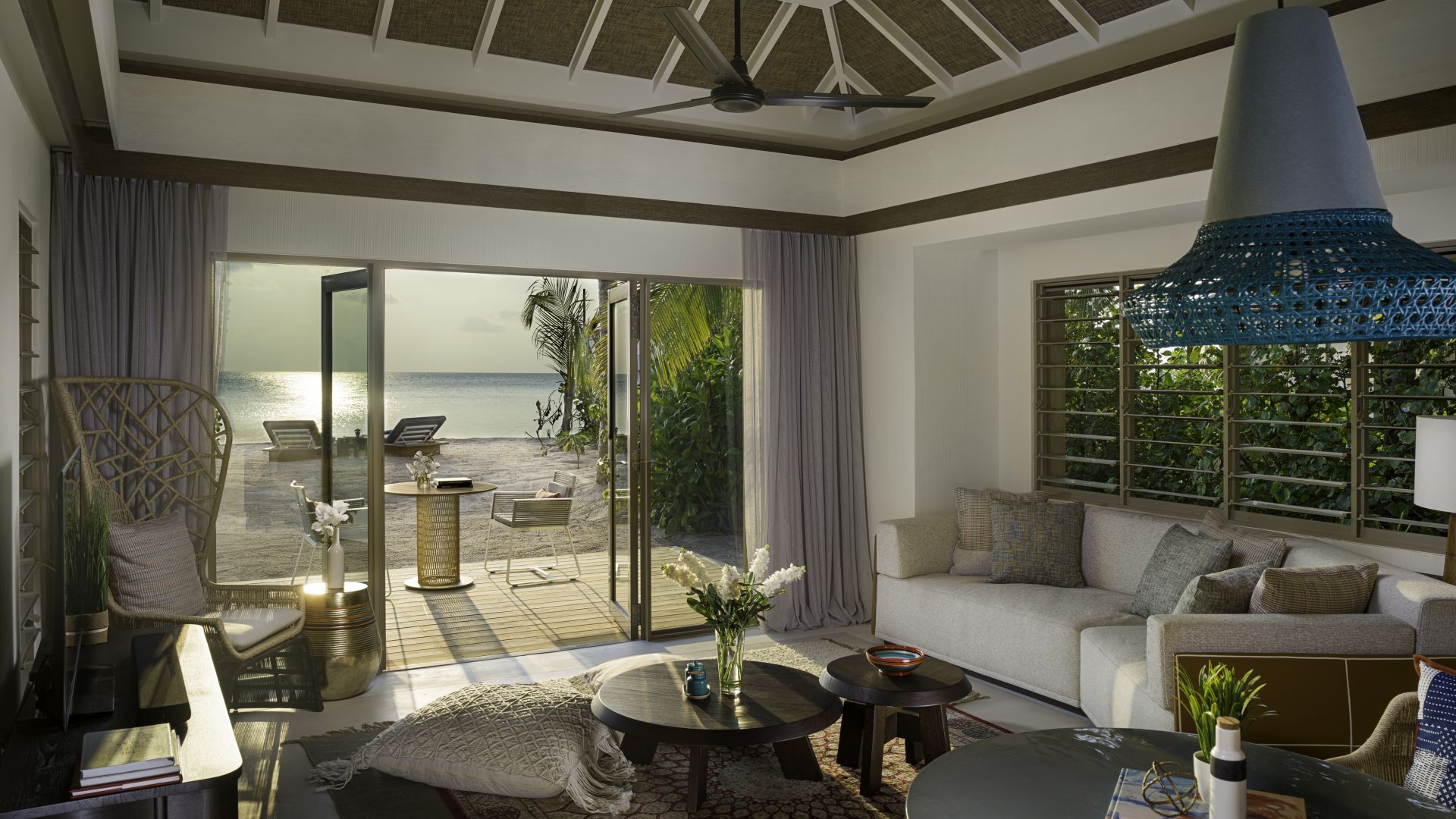 A Living Room Filled With Furniture And A Large Window